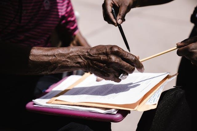 Two people looking at documents